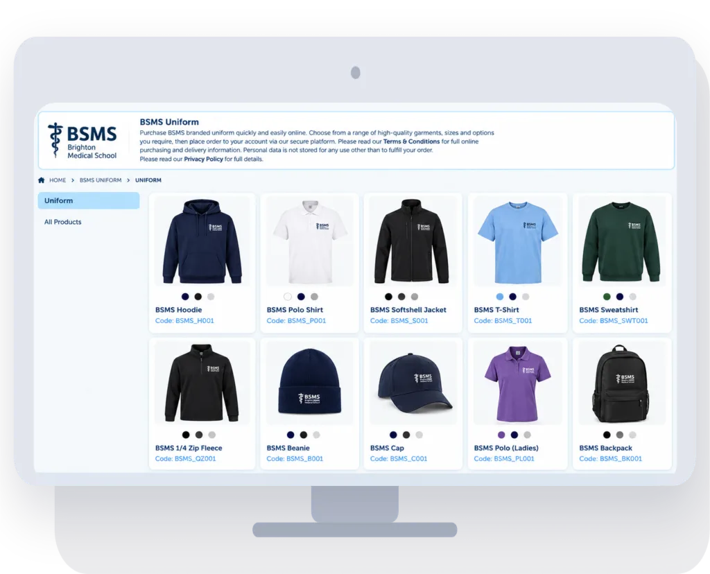 A university uniform store on a desktop monitor showing branded hoodies, polo shirts, jackets, t-shirts, caps and backpacks